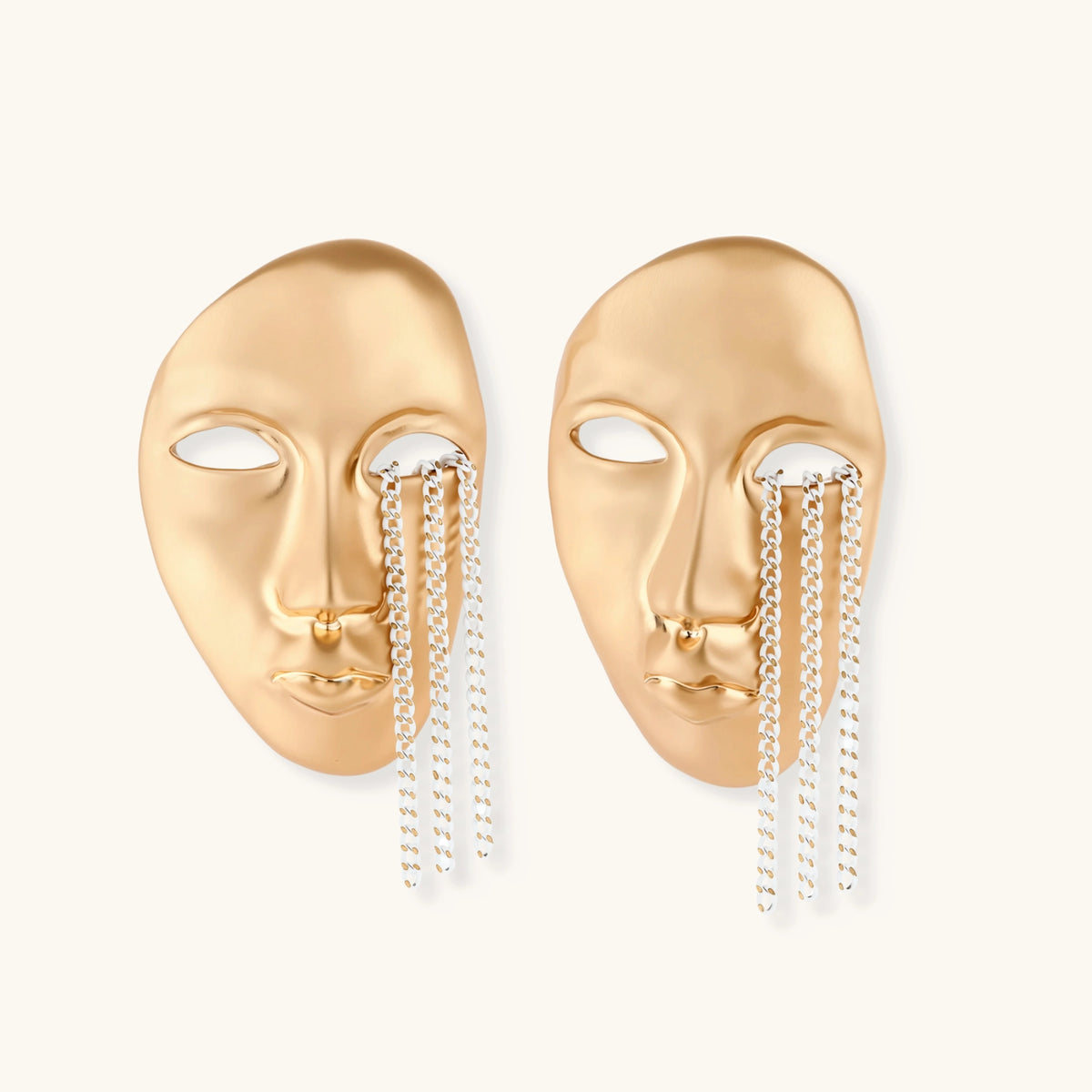 Sculptural face-shaped earrings with flowing chain tassels in polished eco-zinc alloy with sterling silver posts